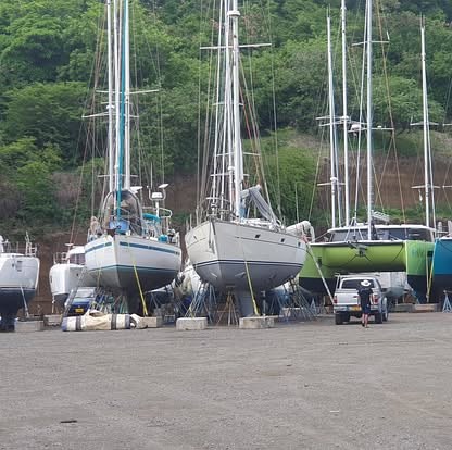 Sailing yachts chocked ashore on hard standing in a Caribbean boatyard