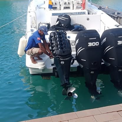Three Mercury Verado 300 outboards on a powerboat being worked on in a Barbados marina